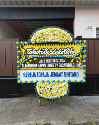 Papan Bunga Duka di Raharja